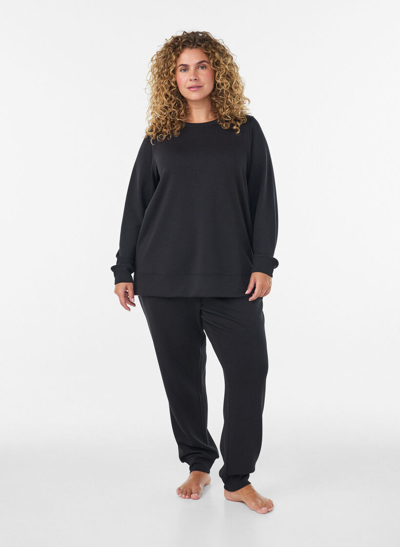 Lang&auml;rmelige Bluse aus Jersey mit Rundhalsausschnitt, Schwarz, Model image number 1