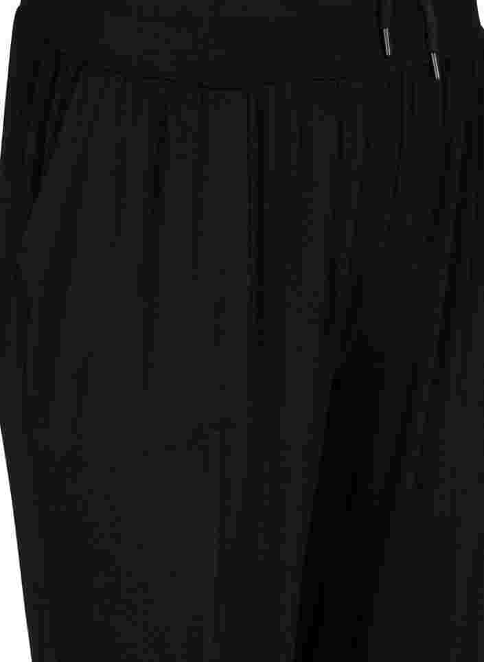 Lockere und dehnbare Trainingshose mit Taschen, Black, Packshot image number 2