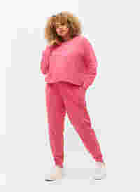 Jogginghose mit Print und Taschen, Hot Pink AOP, Model